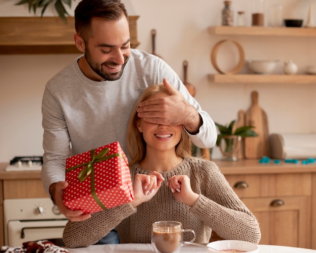 Medium shot man surprising woman