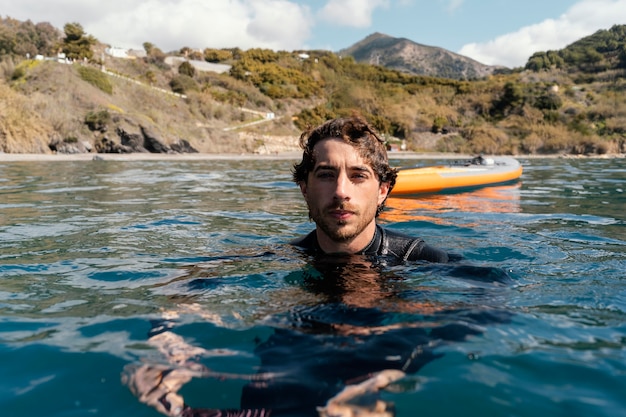 Medium shot man swimming