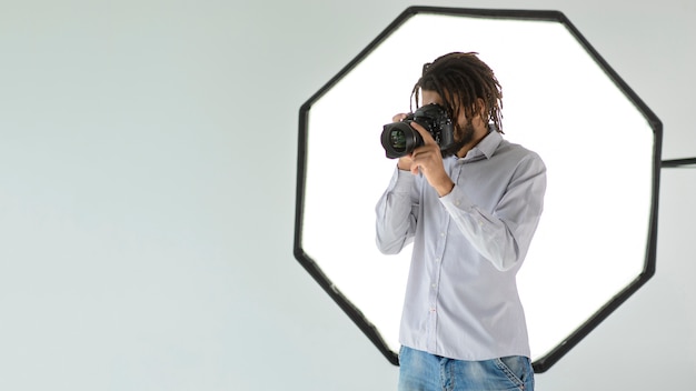 medium shot man taking photos