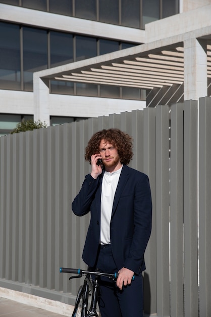 Medium shot man talking on phone outdoors