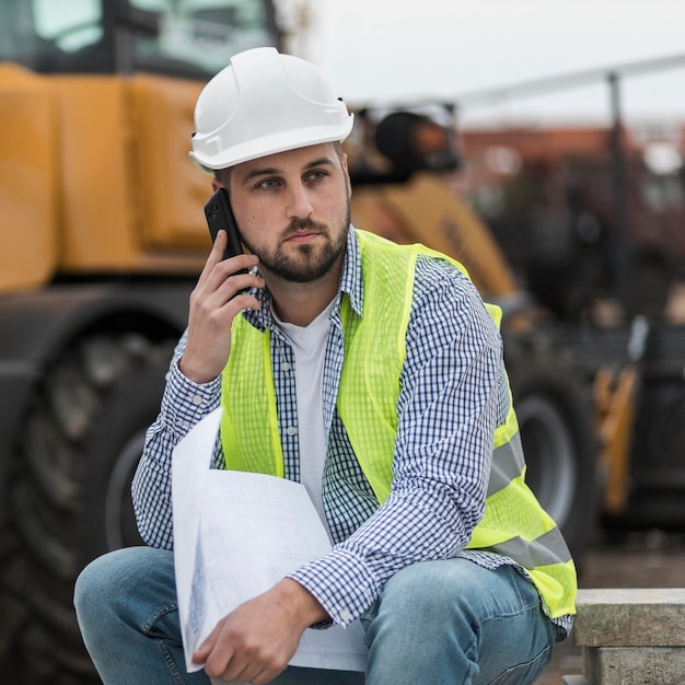 Medium shot man talking over phone