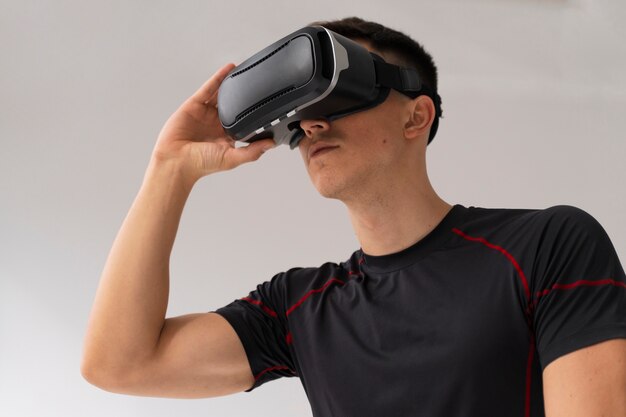 Medium shot man training with vr glasses on