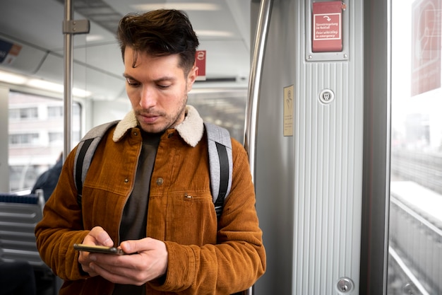 Medium shot man traveling with phone