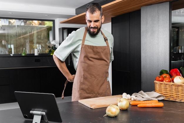 Medium shot man tying apron