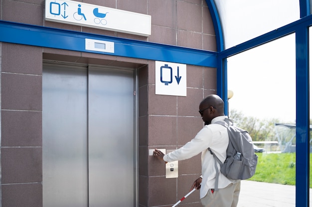 Medium shot man using braille alphabet