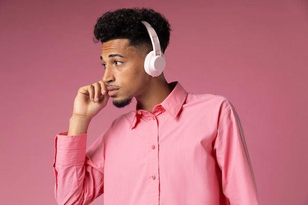 Medium shot man wearing headphones