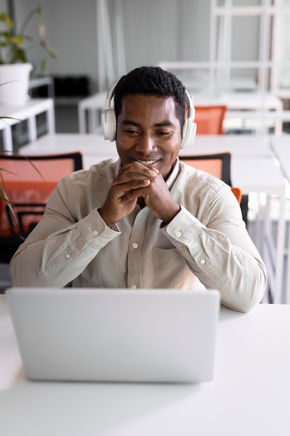 Medium shot man wearing headphones