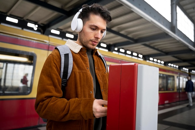 Free photo medium shot man wearing headphones