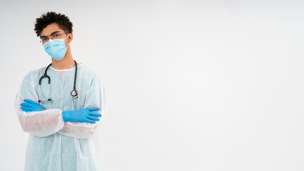 Medium shot man wearing medical gown