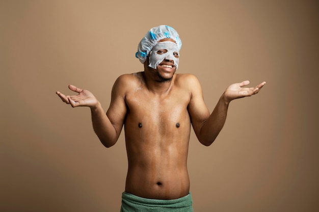 Free photo medium shot man wearing shower cap