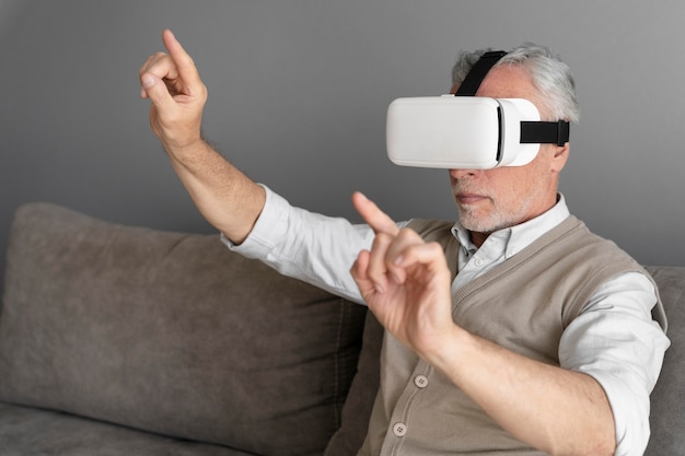 Free photo medium shot man wearing vr glasses