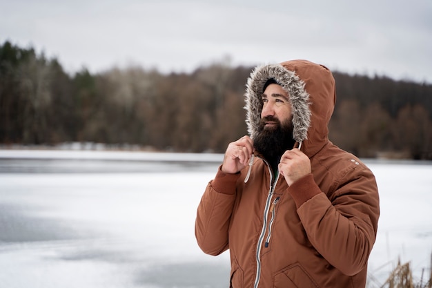 Medium shot man wearing warm clothes