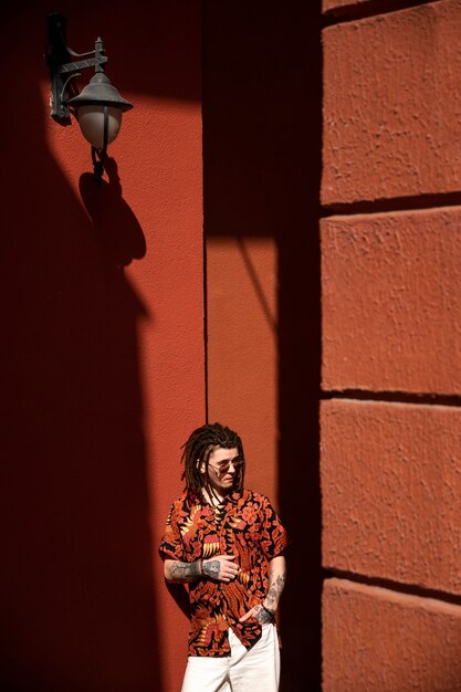 Medium shot man with afro dreadlocks outdoors