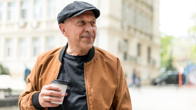 Medium shot man with  coffee cup