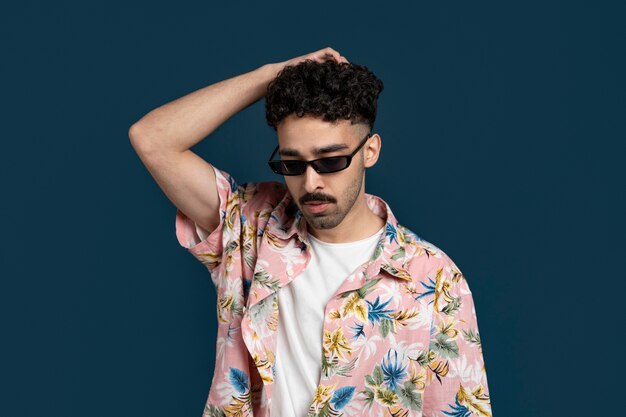 Medium shot man with hawaiian shirt wearing sunglasses