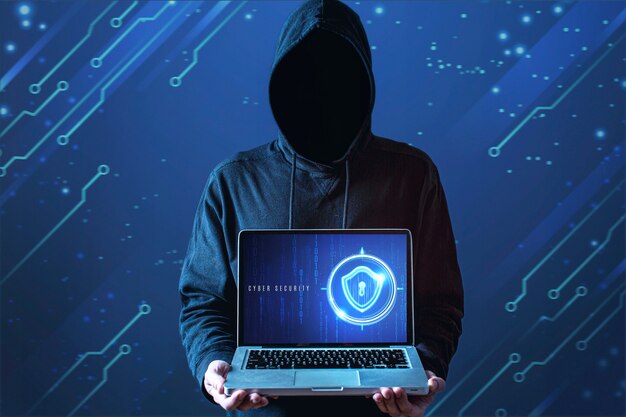 Medium shot man with hoodie holding laptop