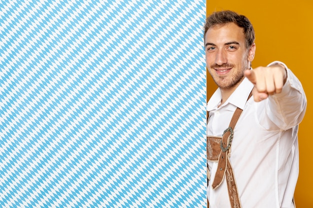 Medium shot of man with patterned sign