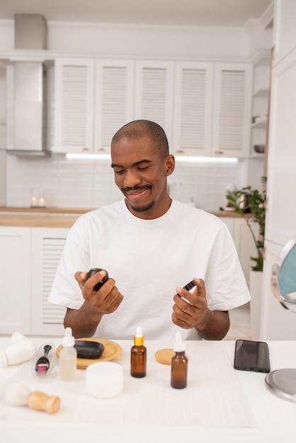 Medium shot man with skincare products