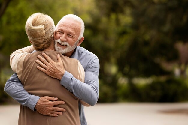 Medium shot man and woman hugging