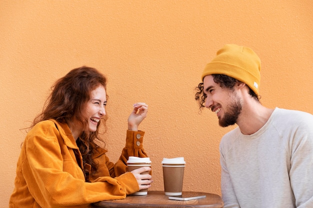 Medium shot man and woman with coffee