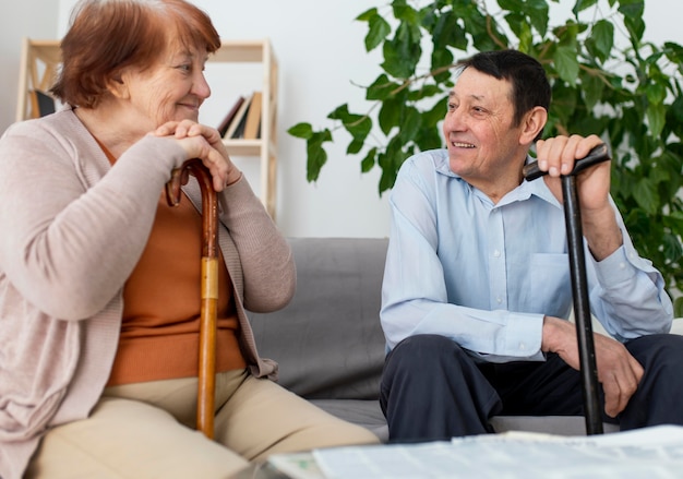 Medium shot man and woman with walking sticks