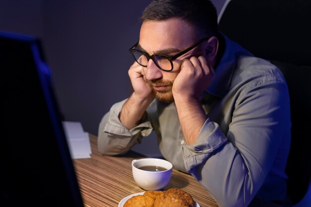 medium shot man working late at night