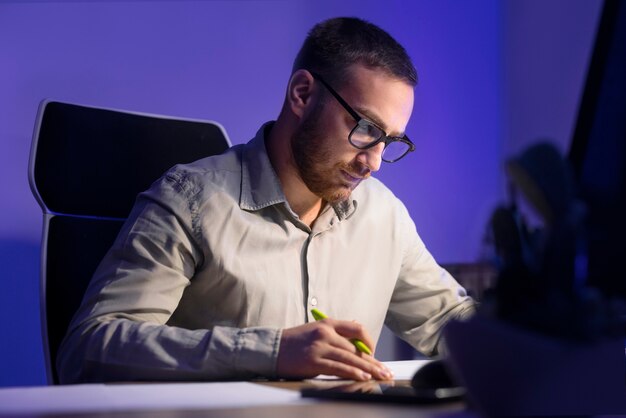 medium shot man working late at night