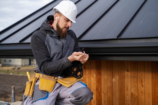 Medium shot man working with helmet