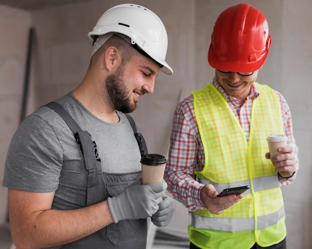 Medium shot men holding coffee cups