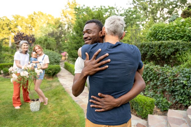 Medium shot men hugging