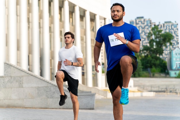 Medium shot men running outside