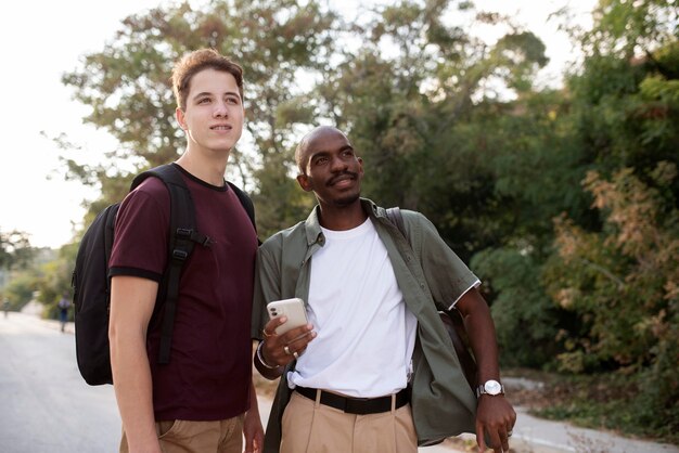 Medium shot men traveling together