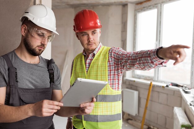 Medium shot men wearing helmets