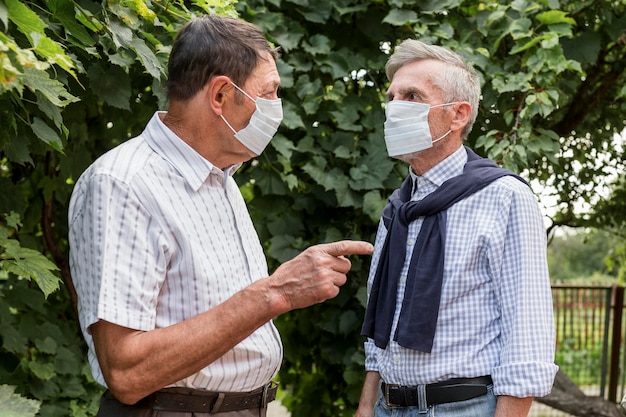 Medium shot men wearing masks