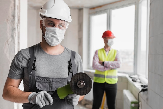 Medium shot men with equipment and tools