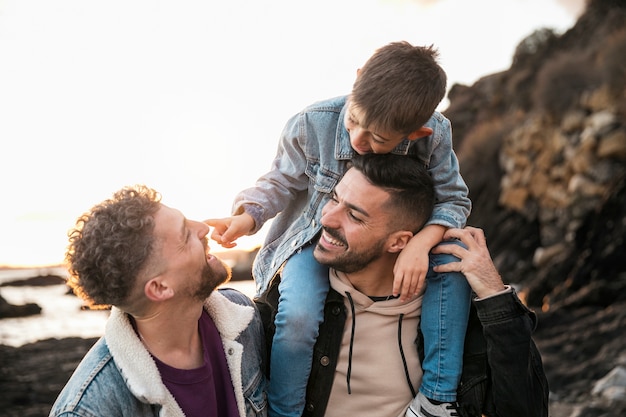 Medium shot men with kid in nature