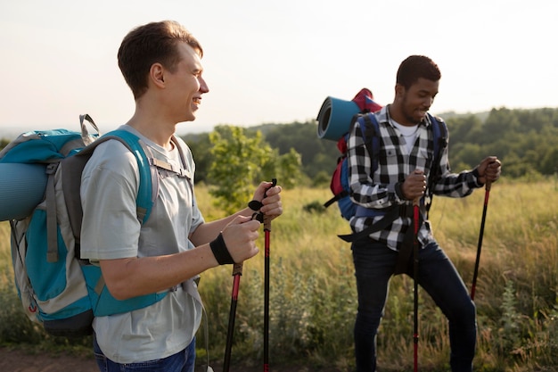 Free photo medium shot men with sticks