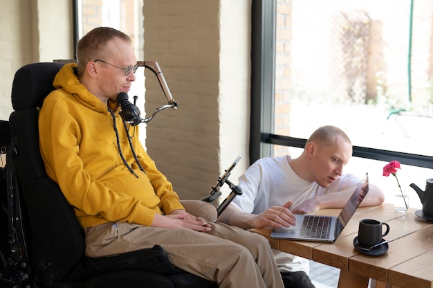 Medium shot men working together indoors