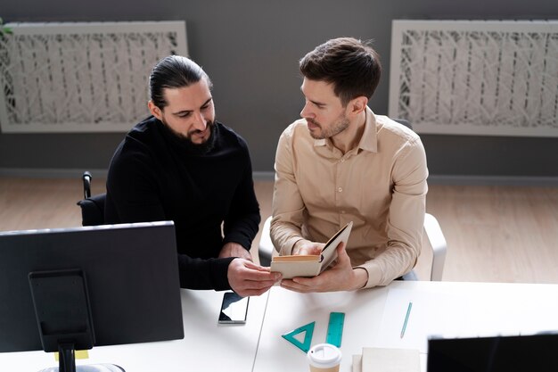 Medium shot men working together