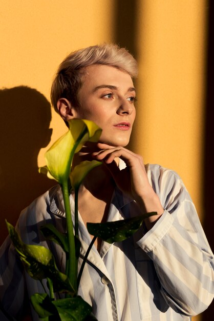 Medium shot model posing with flowers