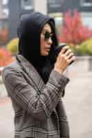 Free photo medium shot model wearing black hood