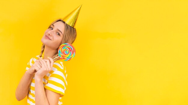 Free photo medium shot model wearing party hat