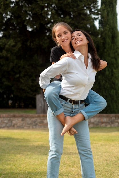 Medium shot mother carrying girl