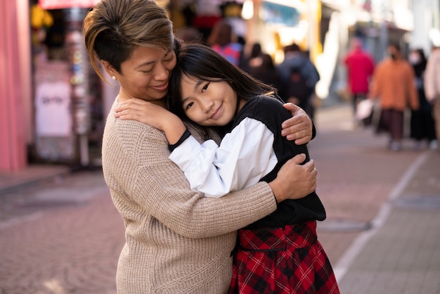 Free photo medium shot mother and girl hugging