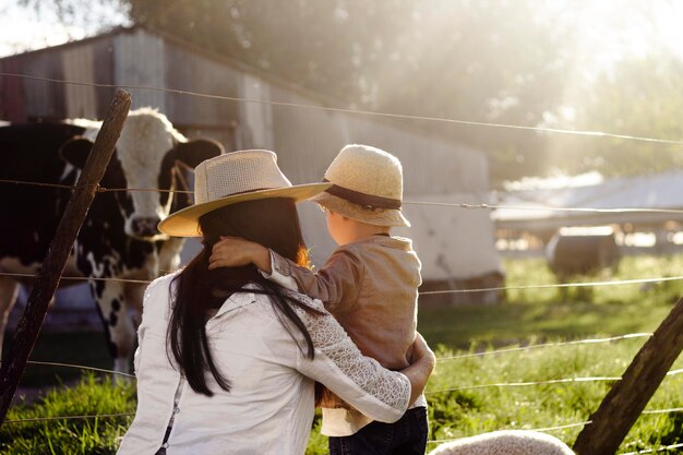 Medium shot mother holding kid