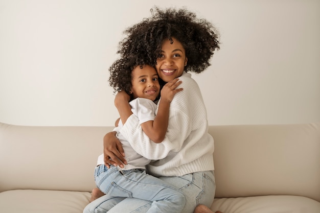 Medium shot mother hugging kid