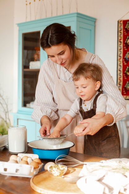 medium shot mother and kid living at farmhouse