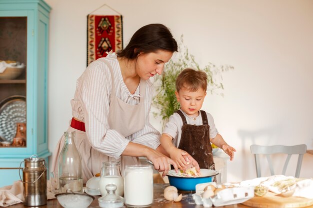 Medium shot mother and kid living at farmhouse