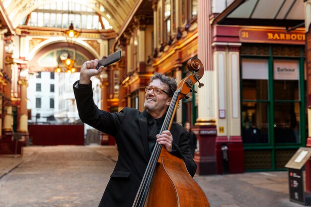 Medium shot musician taking selfie