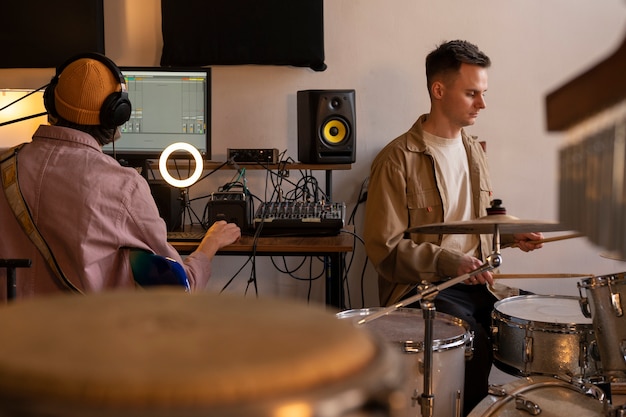 Medium shot  musicians working in studio